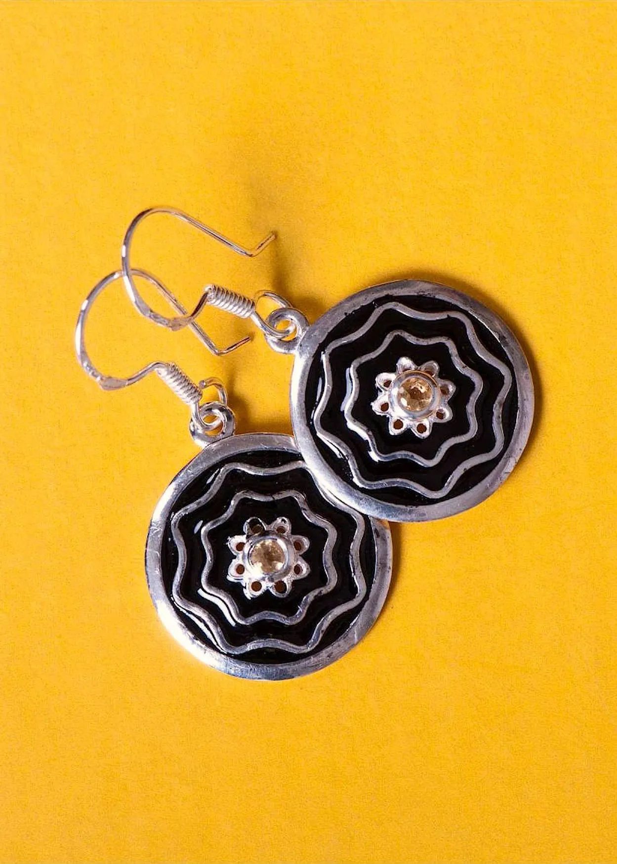 Dainty, round earrings with citrine and fine black enamel work